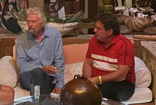 Dr. Paul A. Pereira alongside global business leaders